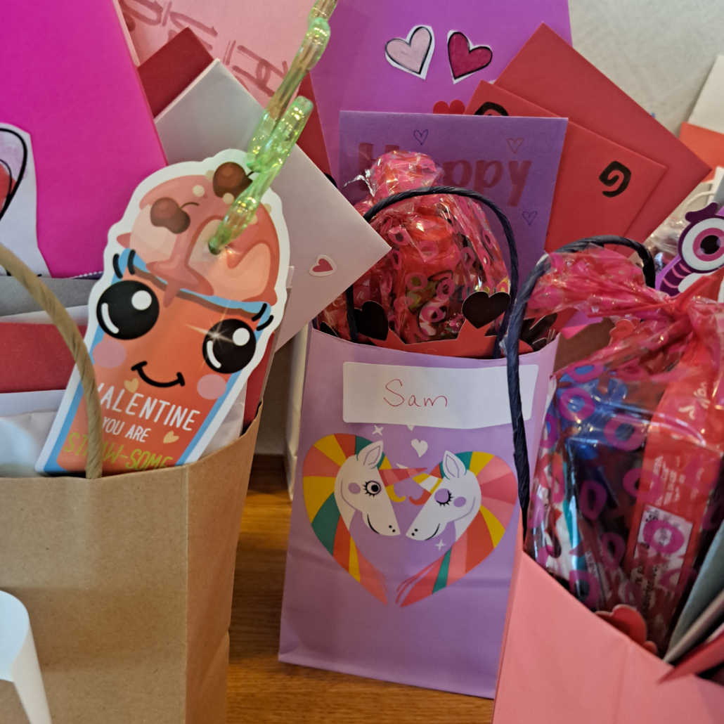 Images of valentine treat bags stuffed with volunteers' love notes